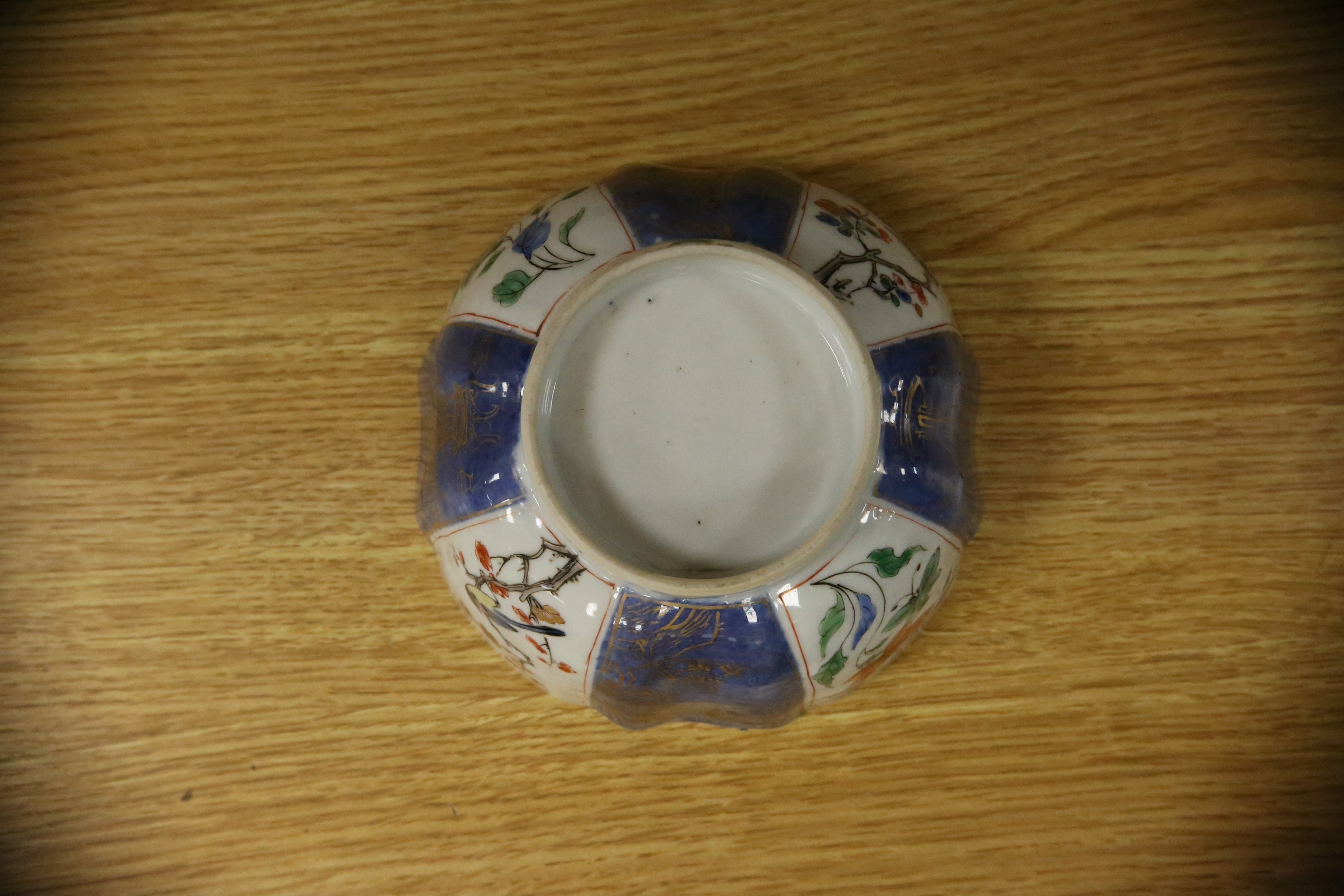 A Chinese famille verte powder blue ground bowl and a similar dish, both Kangxi period, 27.5cm diameter. Condition - dish poor, bowl fair